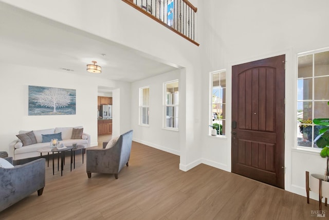 830 Elderberry Loop, Vacaville, CA 95688 - foyer entrance with a healthy amount of sunlight, wood finished floors, and baseboards