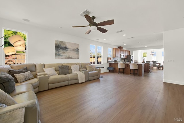 830 Elderberry Loop, Vacaville, CA 95688 - living area featuring visible vents, wood finished floors, ceiling fan, and recessed lighting