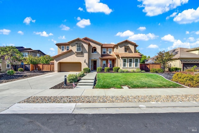 830 Elderberry Loop, Vacaville, CA 95688 - mediterranean / spanish-style house with fence, stucco siding, a tile roof, and concrete driveway
