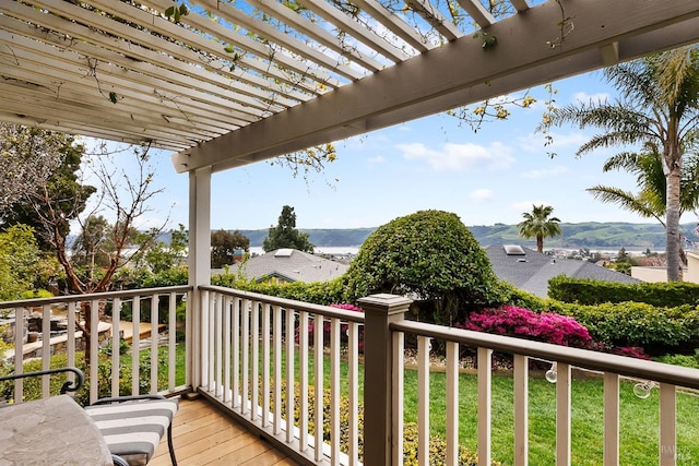 wooden terrace with a pergola