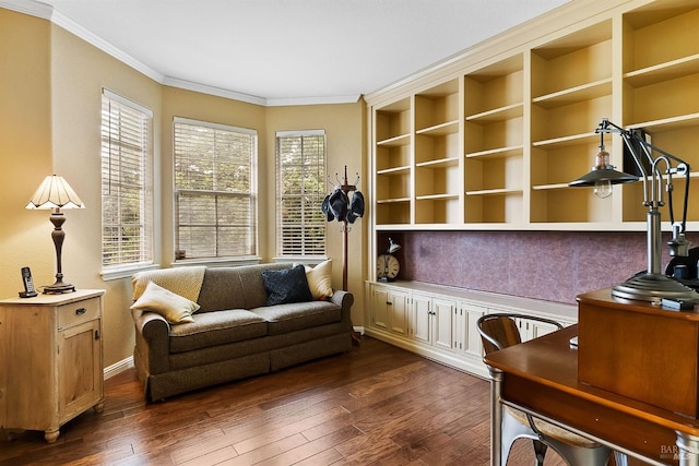 living area with baseboards, built in shelves, dark wood-style flooring, and crown molding