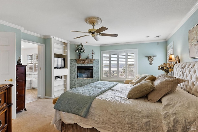 bedroom with a fireplace, crown molding, a ceiling fan, visible vents, and light carpet