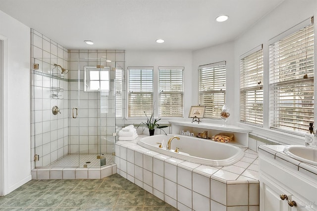 bathroom featuring recessed lighting, tile patterned flooring, a shower stall, vanity, and a garden tub