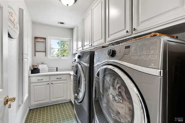 1620 Saint Francis Ct, Benicia, CA 94510 - laundry room featuring cabinet space, washing machine and clothes dryer, and light tile patterned floors