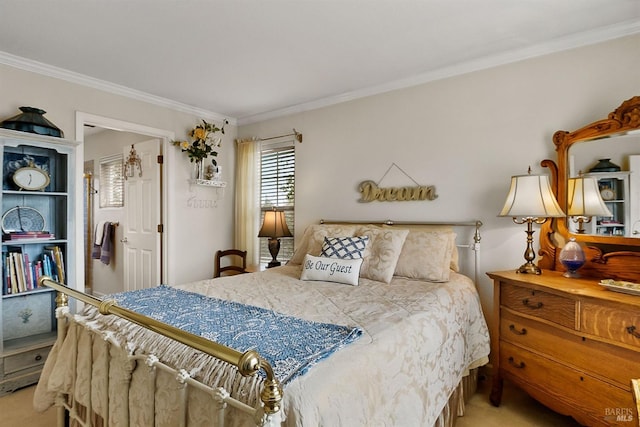 bedroom with ornamental molding and carpet floors