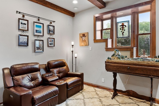 living area featuring recessed lighting, beam ceiling, and baseboards