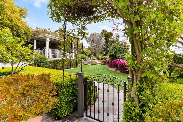 1620 Saint Francis Ct, Benicia, CA 94510 - view of green lawn featuring a gate and a pergola