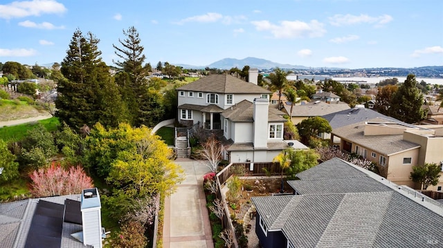 drone / aerial view featuring a mountain view and a residential view