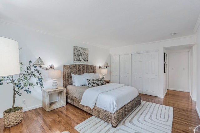 835 S Eliseo Dr, Greenbrae, CA 94904 - bedroom with multiple closets, crown molding, and wood finished floors