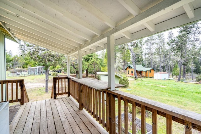 27821 Ten Mile Rd, Point Arena, CA 95468 - wooden deck featuring an outdoor structure, a lawn, and a storage shed
