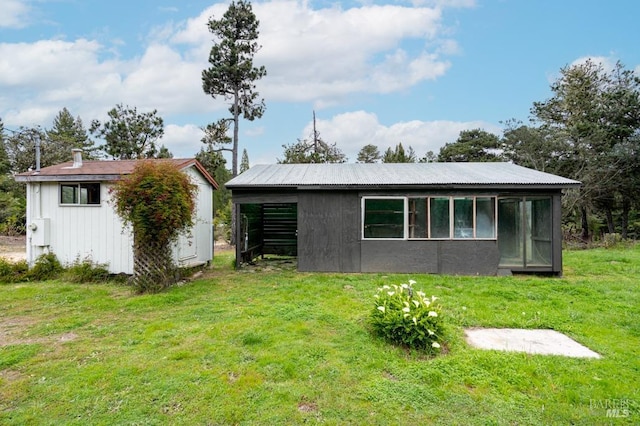 27821 Ten Mile Rd, Point Arena, CA 95468 - back of house with a lawn and an outbuilding
