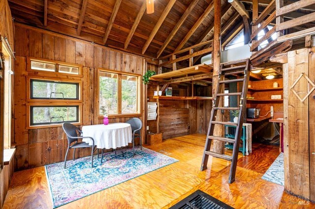 27821 Ten Mile Rd, Point Arena, CA 95468 - bedroom with wooden walls, high vaulted ceiling, and wood finished floors