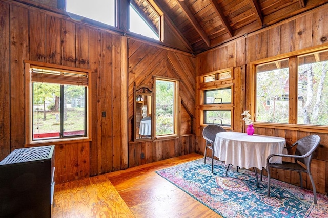 27821 Ten Mile Rd, Point Arena, CA 95468 - dining space with beam ceiling, wooden walls, wooden ceiling, and a healthy amount of sunlight