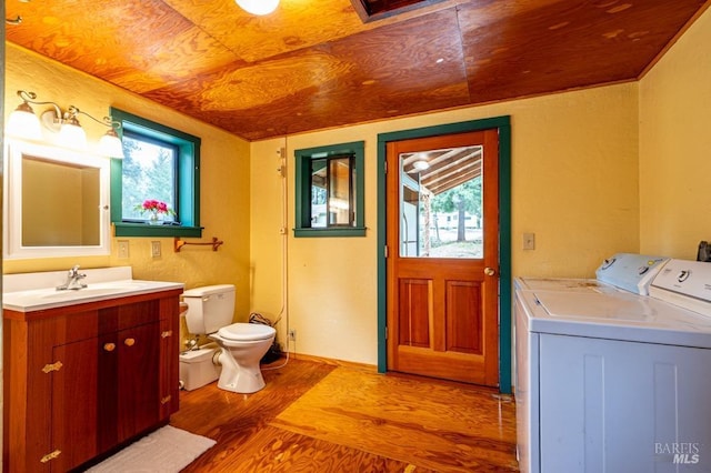 27821 Ten Mile Rd, Point Arena, CA 95468 - bathroom with wood ceiling, wood finished floors, vanity, toilet, and separate washer and dryer