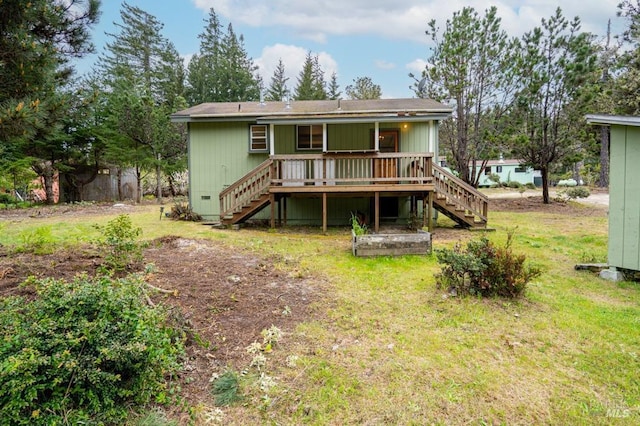 27821 Ten Mile Rd, Point Arena, CA 95468 - rear view of property with stairs, a lawn, and a deck