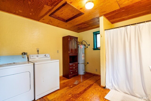 27821 Ten Mile Rd, Point Arena, CA 95468 - laundry room with light wood-style floors, attic access, wooden ceiling, water heater, and separate washer and dryer