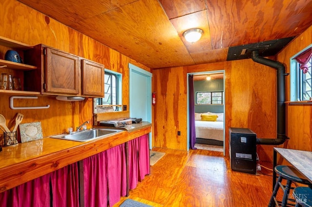 27821 Ten Mile Rd, Point Arena, CA 95468 - kitchen featuring a sink, wood ceiling, wood walls, and light wood-style flooring