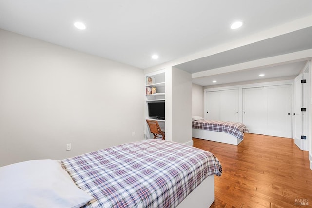 bedroom featuring recessed lighting and wood finished floors