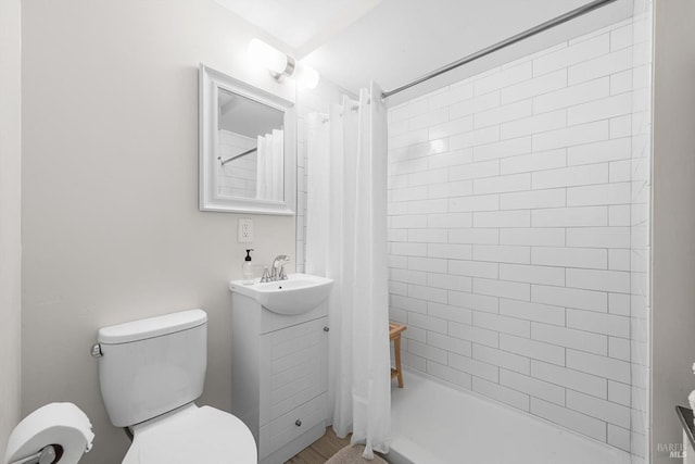 bathroom featuring toilet, a sink, and shower / bathtub combination with curtain