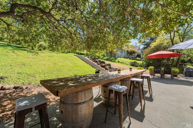 view of patio with outdoor dry bar