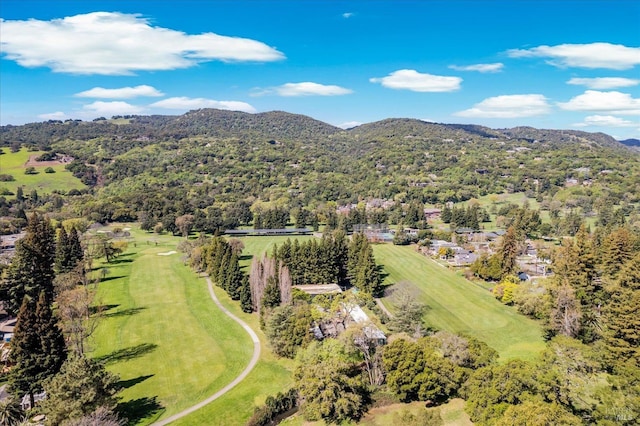 aerial view featuring view of golf course and a mountain view