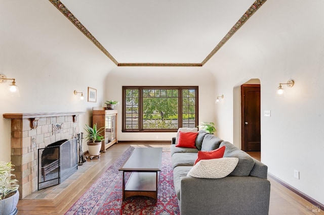 36 Wilson Ave, Vallejo, CA 94590 - living area with a fireplace, ornamental molding, arched walkways, and light wood-type flooring