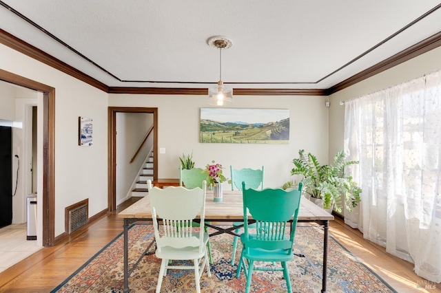 36 Wilson Ave, Vallejo, CA 94590 - dining room with ornamental molding, visible vents, stairway, light wood-style flooring, and baseboards