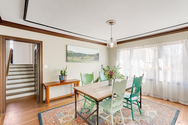 36 Wilson Ave, Vallejo, CA 94590 - dining area featuring ornamental molding, light wood finished floors, and stairway