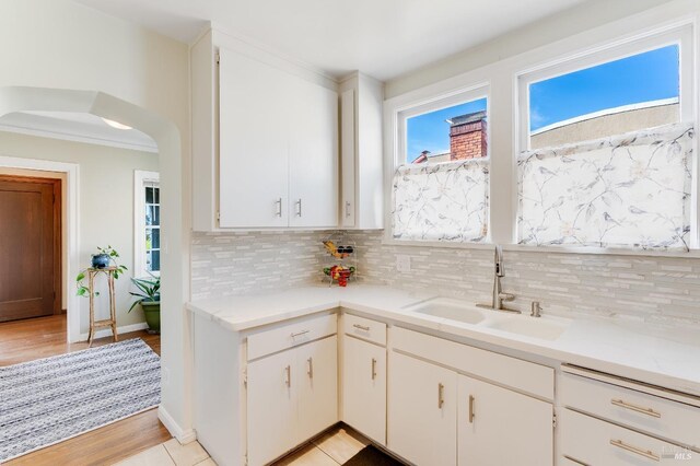 36 Wilson Ave, Vallejo, CA 94590 - kitchen with a sink, tasteful backsplash, light countertops, and arched walkways