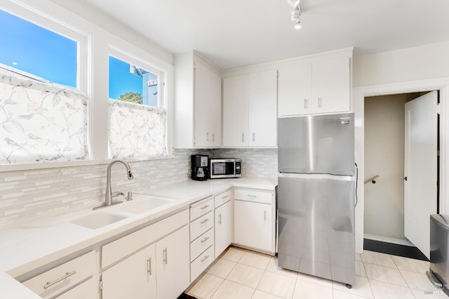 36 Wilson Ave, Vallejo, CA 94590 - kitchen with a sink, stainless steel appliances, tasteful backsplash, and light countertops