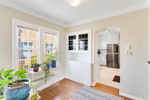36 Wilson Ave, Vallejo, CA 94590 - doorway to outside with light wood finished floors, crown molding, and arched walkways