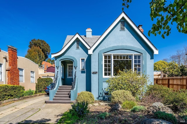 36 Wilson Ave, Vallejo, CA 94590 - english style home with stucco siding, a chimney, and fence