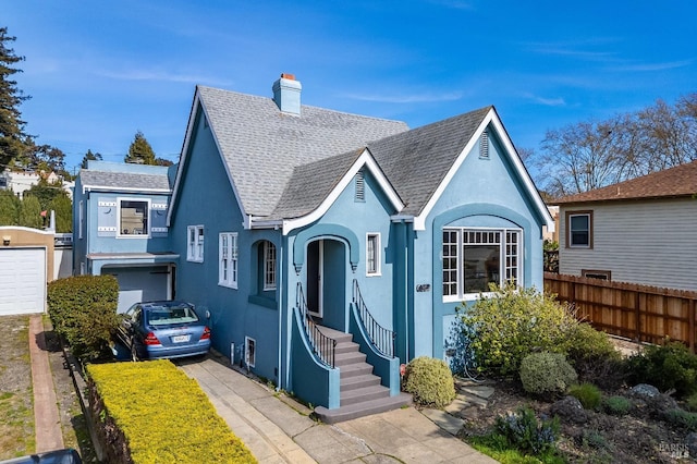 36 Wilson Ave, Vallejo, CA 94590 - view of front of property featuring a chimney, stucco siding, roof with shingles, and fence
