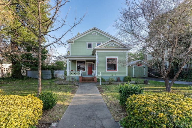 701 W Clay St, Ukiah, CA 95482 - victorian-style house with fence, an outbuilding, a storage unit, a front lawn, and covered porch