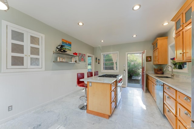 701 W Clay St, Ukiah, CA 95482 - kitchen featuring light countertops, a kitchen island, glass insert cabinets, a sink, and stainless steel dishwasher