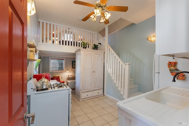 701 W Clay St, Ukiah, CA 95482 - kitchen featuring light countertops, white appliances, light tile patterned floors, a sink, and a ceiling fan