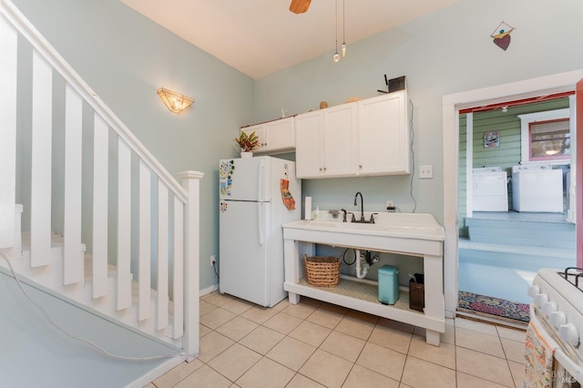 701 W Clay St, Ukiah, CA 95482 - kitchen featuring light tile patterned flooring, white cabinets, white appliances, a ceiling fan, and washing machine and dryer
