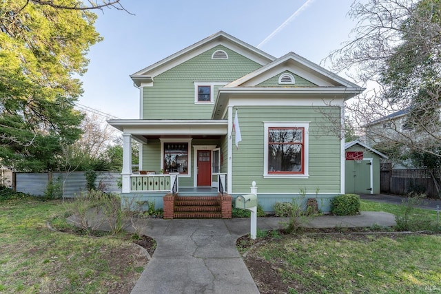 701 W Clay St, Ukiah, CA 95482 - view of front facade featuring an outdoor structure, a porch, fence, and a storage shed