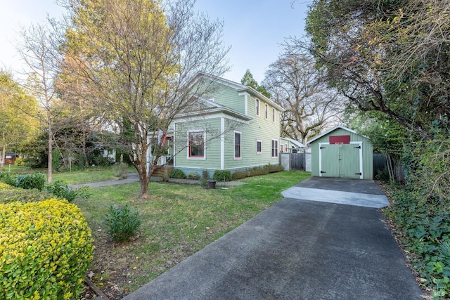 701 W Clay St, Ukiah, CA 95482 - view of front facade with driveway, a shed, fence, an outdoor structure, and a front lawn