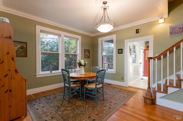 701 W Clay St, Ukiah, CA 95482 - dining space with visible vents, crown molding, stairway, and wood finished floors