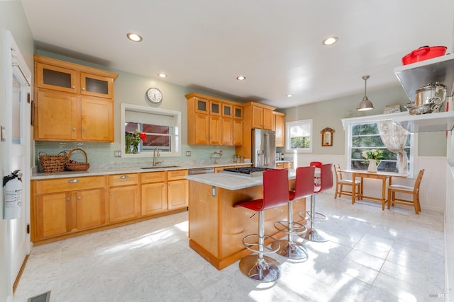 701 W Clay St, Ukiah, CA 95482 - kitchen featuring a breakfast bar area, stainless steel appliances, a center island, a sink, and visible vents