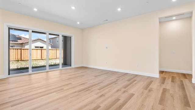 empty room with recessed lighting, baseboards, and light wood-style flooring