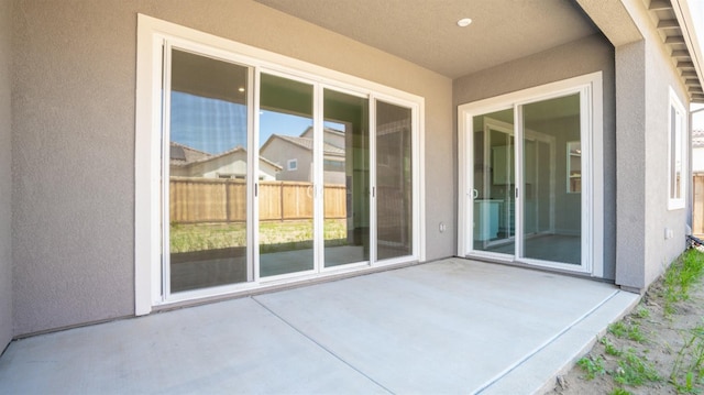 view of patio featuring fence