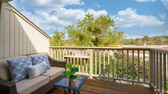 wooden deck with an outdoor hangout area