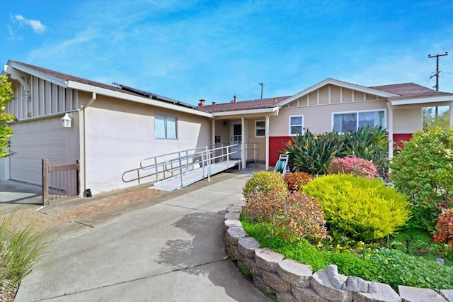 1014 Falcon Dr, Vallejo, CA 94589 - ranch-style house with stucco siding, board and batten siding, and solar panels