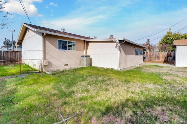 1014 Falcon Dr, Vallejo, CA 94589 - rear view of house featuring a fenced backyard, central air condition unit, and a yard