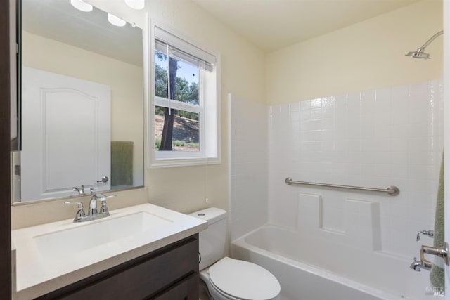 full bath featuring washtub / shower combination, toilet, and vanity