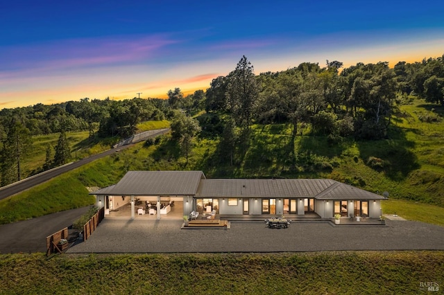exterior space with a carport and driveway