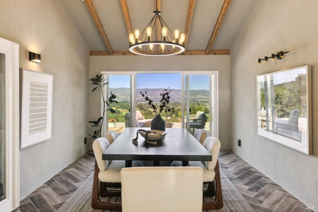 dining space featuring beam ceiling, high vaulted ceiling, a mountain view, dark wood-style floors, and a chandelier
