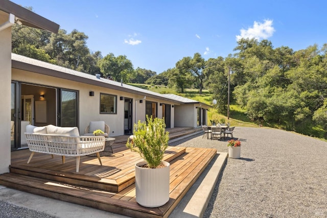 exterior space with a deck and outdoor dining space